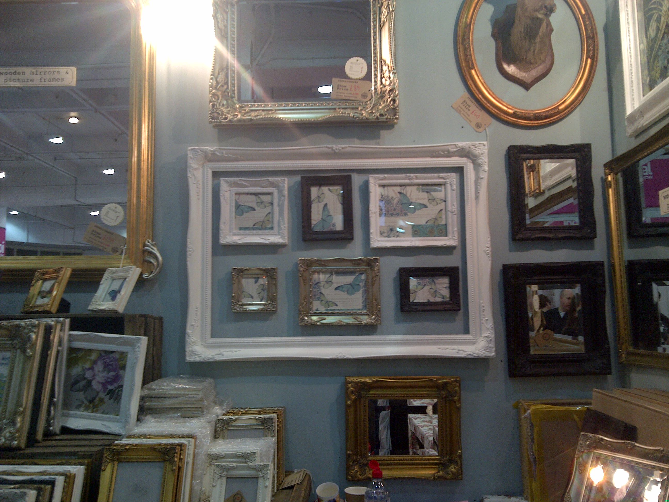 How cool is this! Picture frames within a large frame... excellent for not making a wall look too cluttered